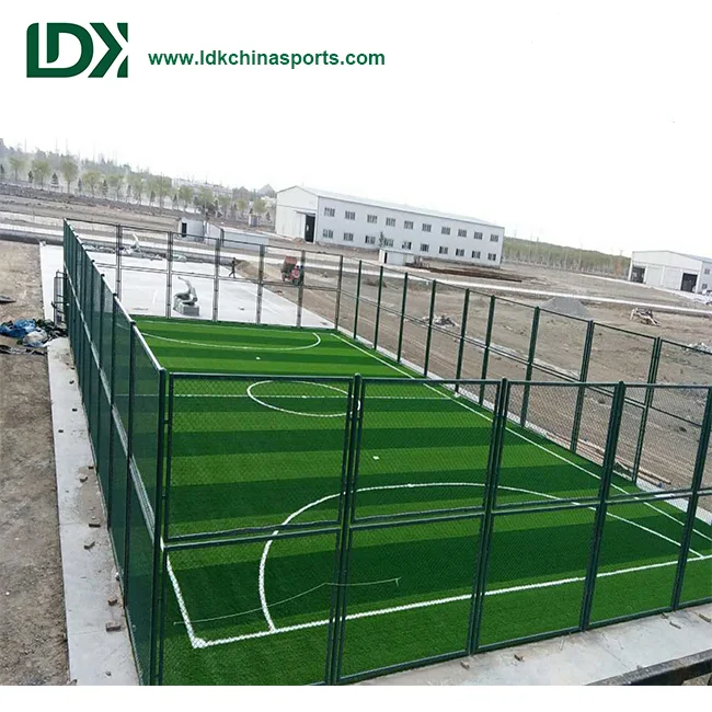 Enclosed cage football facility featuring heavy-duty mesh goal frames for compact training environments